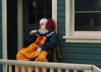 Tim Curry as Pennywise taking a break on the set of IT