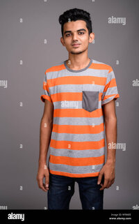 Young indian man against gray background MT86EE 1