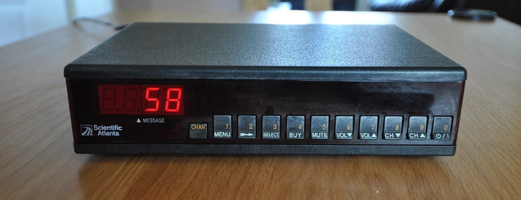 A vintage scientific atlanta cable box with numeric buttons v0 g4q78fz8ifq81