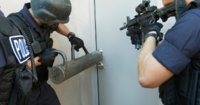 Police-officers-breaking-down-doors.jpg